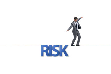 Fototapeta premium Businessman in risk concept walking on tight rope