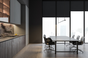Side view of gray kitchen, table and shelves