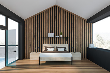 Gray attic master bedroom with balcony