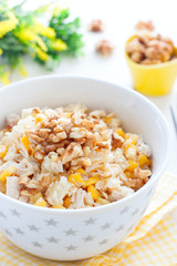 Salad with corn and pineapples in a white bowl, selective focus