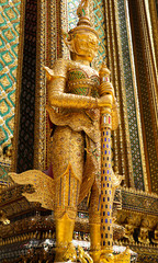 Fototapeta premium Wat Phra Kaew or Temple of Emerald Buddha, Guardian statues and Grand palace located within the grounds of the Grand Palace in Bangkok is Thailand’s most sacred temple and pilgrimage site for Thai