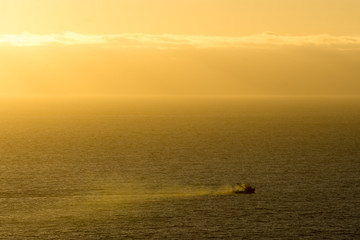 fishing boat at sunset