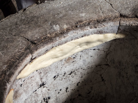 baking Georgian bread in a round oven