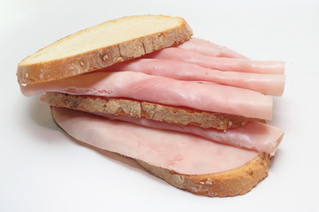 panino a fette italiano con prosciutto cotto su sfondo bianco, italian sliced sandwich with cooked ham on white background