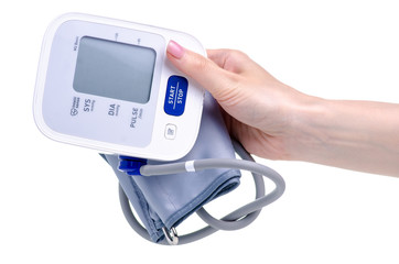 Digital blood pressure monitor electric tonometer in hand on white background isolation