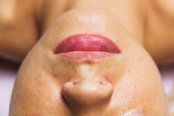 Female lips are real without retouching close-up. Correction and lip augmentation. The lips and...
