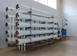 Reverse osmosis system - installation of industrial membrane devices © Wingedbull