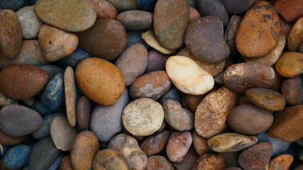 Fototapeta na wymiar brown stone background, pebble beach stone