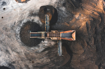 Aerial photo of a vibrating aggregate screen machine with 3 chutes from above, used for screening...