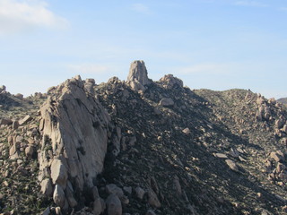 View of Tom's Thumb seen from the trail in the McDowell Sonoran mountain preserve with blue sky in the background