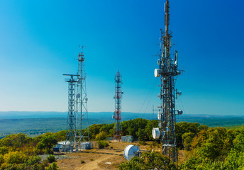 Communication antenna towers on blue sky