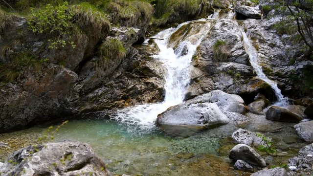 Tiny waterfall at the Val Vertova Torrent near Bergamo,Seriana Valley,Italy,