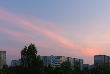 Dramatic blue sky with clouds over the city, background