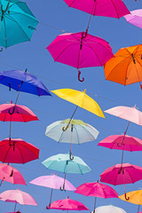 Fototapeta na wymiar colorful, flying umbrellas