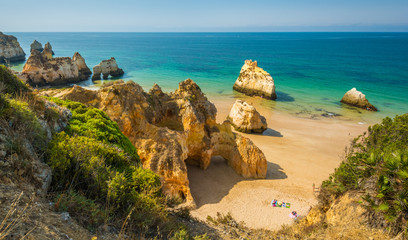 Scenic golden cliffs near Alvor, Portimao, Algarve, Portugal. - obrazy, fototapety, plakaty