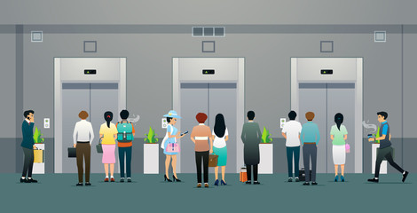 Male and female office workers are waiting for the elevator. © intararit
