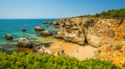 Scenic golden cliffs near Alvor, Portimao, Algarve, Portugal.