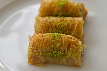 White saucepan with pistachio on it