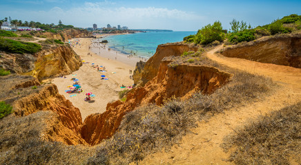 Scenic golden cliffs near Alvor, Portimao, Algarve, Portugal.