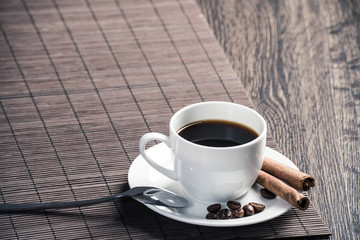 Cup of espresso coffee on wooden table