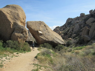 View of a trail with hikers on the path to Tom's Thumb in the McDowell Mountains in the Sonoran...