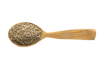 zira in wooden spoon isolated on white background. spice for cooking food, top view.