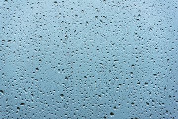 Background of water with water drops on glass
