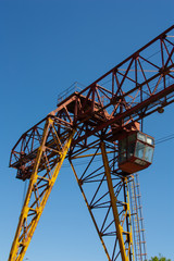Fototapeta na wymiar Old rusty overhead crane. Industrial construction