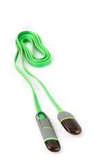 Green plastic cable USB-Lightning on white background. Close up