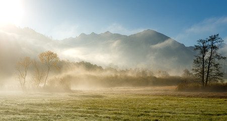 Foggy Sunrise in Mountains. Dramatic Picturesque Scene. Autumn in Nature. Rural Landscape. Beautiful Alpine View. Europe. Wonderful Nature in the world.
