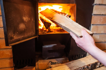 Sauna stove, firewood and fire in the stove. The concept of a bath, sauna, health care, cleanliness, body treatments.