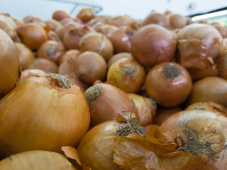 Heap of onions on the market