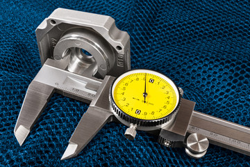 Caliper jaws closeup. Internal hole diameter measuring on a blue net background. Measurement of...