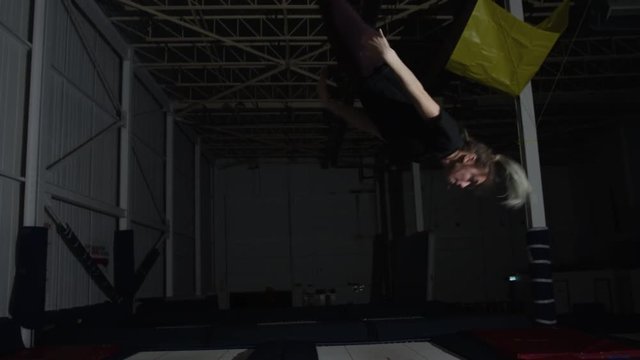 Girl indoor gymnastic parkour flips and tricks