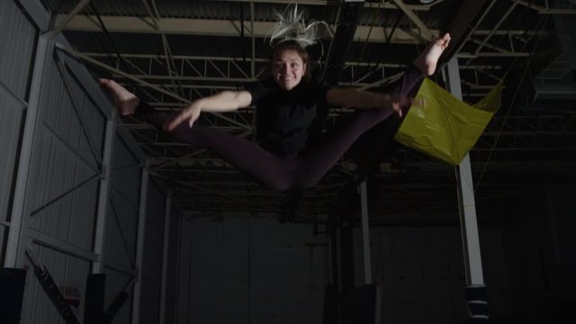 Girl indoor gymnastic parkour flips and tricks
