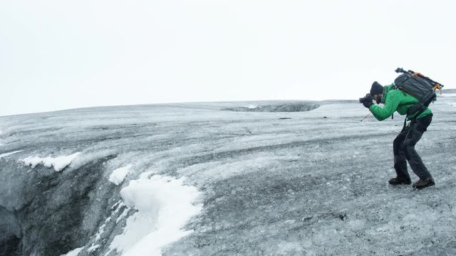 Adventurous Iceland Photographer on Glacier Walk.