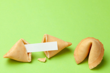 Chinese fortune cookies. Cookies with empty blank inside for prediction words. Green background...