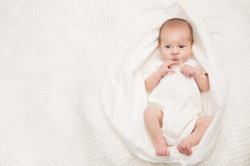 Newborn Baby Portrait, Beautiful New Born Kid sucking Pacifier, Child two weeks old