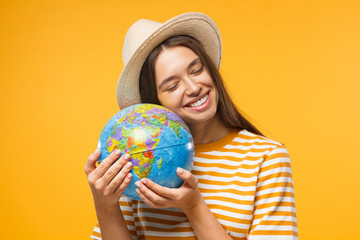 European Caucasian girl hugging globe sphere, isolated on background, concept of environmental care