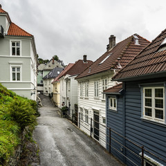 Fototapeta na wymiar Narrow cozy street in the old town of Bergen with traditional wooden houses, Norway