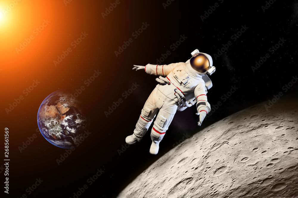 Wall mural astronaut floating in outer space