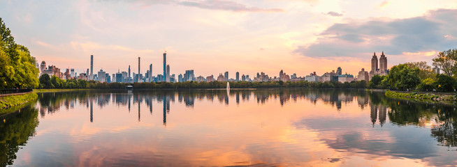 Sunset View of Manhattan skyline from Jacqueline Kennedy Onassis Reservoir in Central Park,...