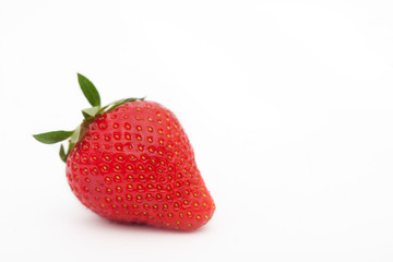 One fresh strawberry isolated on white background