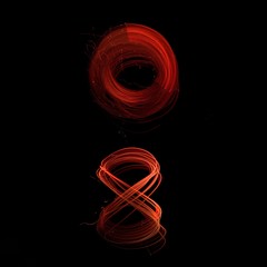 glowing red symbol on black background