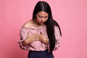 Young Asian woman got chest pain.