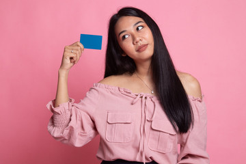 Happy young Asian woman with a blank card.