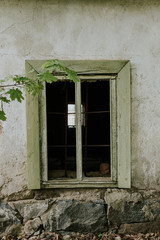 Fototapeta na wymiar Old barn window with smashed glass