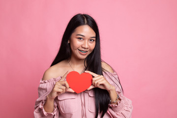 Asian woman with red heart.