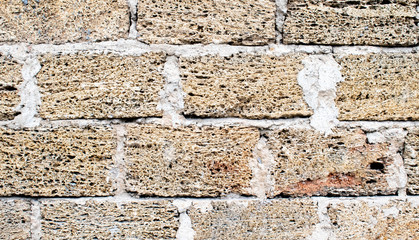brick wall, yellow brick. shell bricks