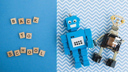 Back to school concept. A metal robot and an electronic board that can be programmed. Robotics and electronics. DIY robotics. STEM and STEAM education for kids. Free space for text.